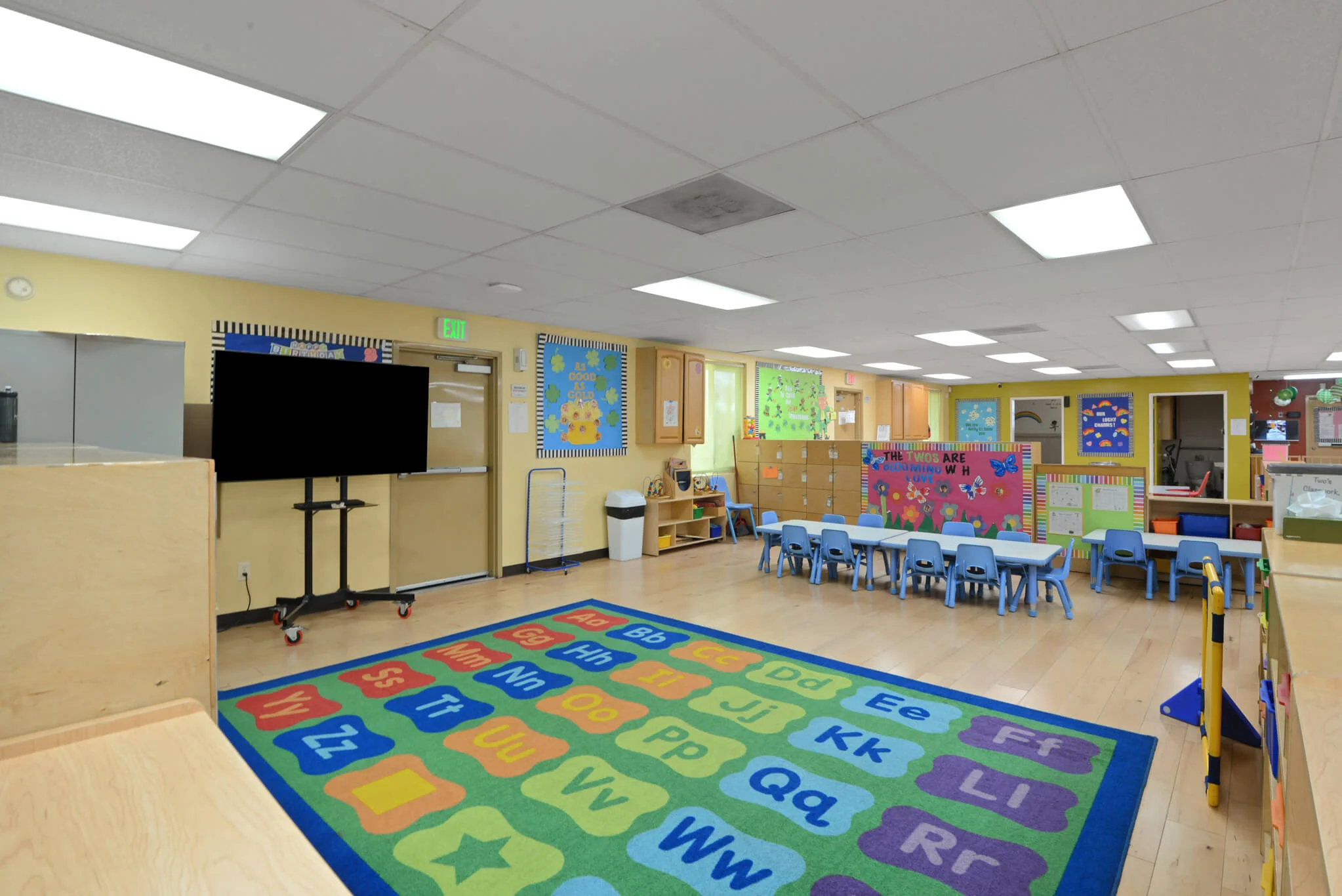 Three to four year old children engaged in guided discovery activities and structured hands-on learning in a Junior Pre-K classroom at Sierra Preschool