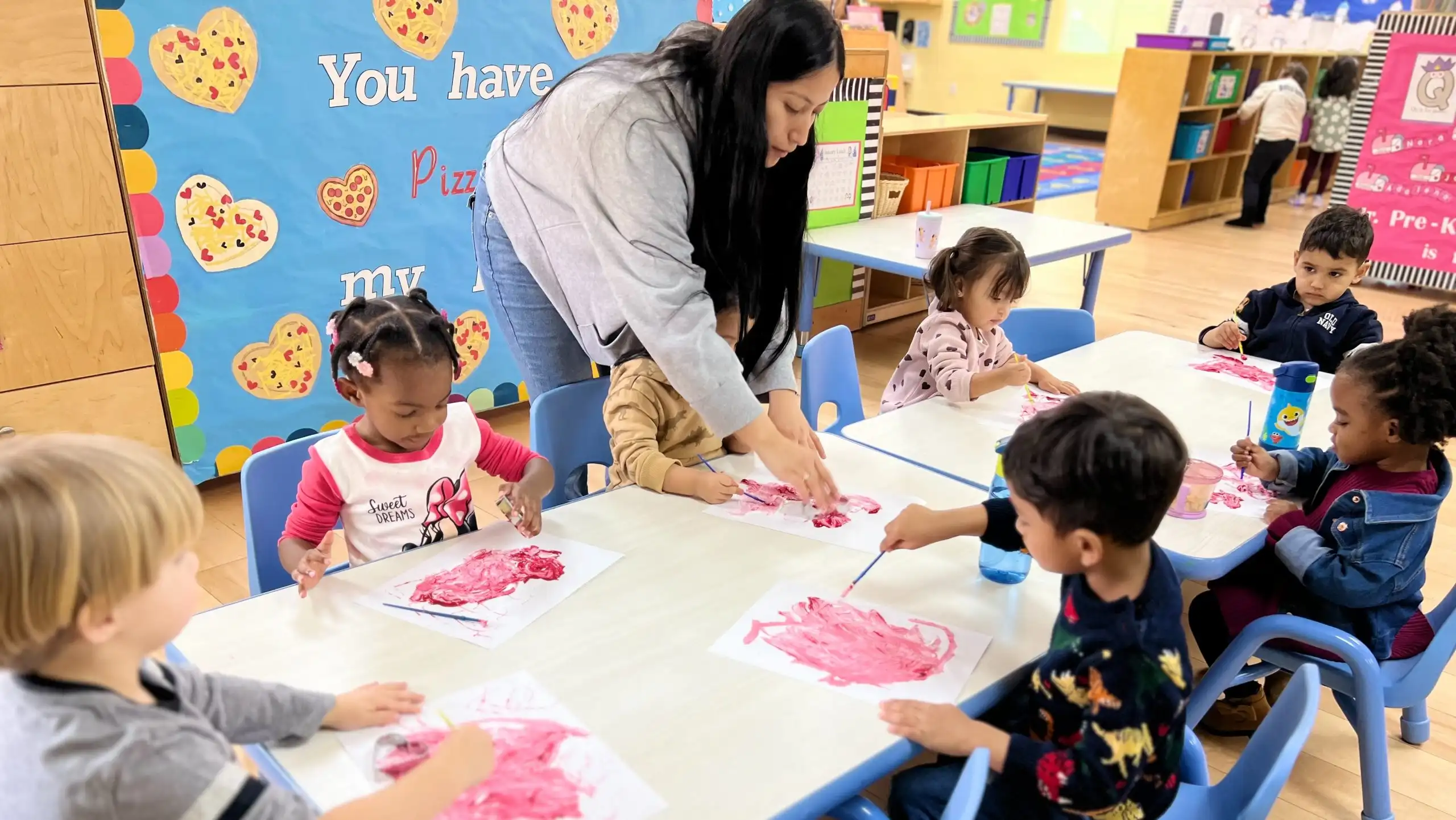 Experienced educators nurturing and caring for young children during critical early brain development years at Sierra Preschool