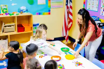 3-year-old children in Sierra Preschool's Junior Pre-K program playing with clay in a hands-on creative learning activity